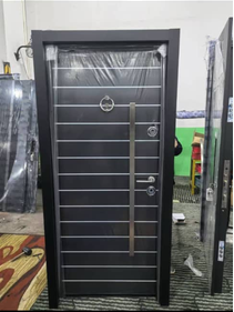 Graphite Slat Bronze Handle Door — Doors