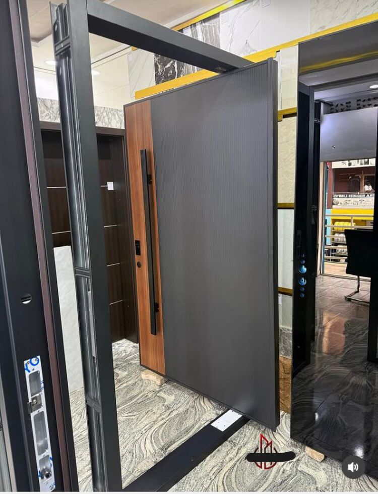 Walnut & Graphite Ribbed Pivot Door — Doors