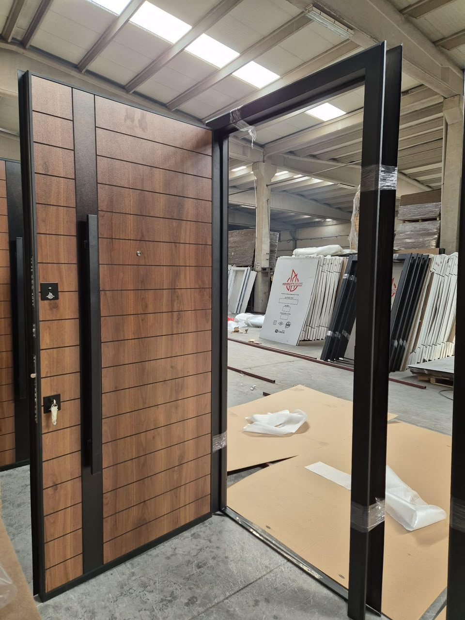 Warm Walnut Slat Pivot Door — Doors